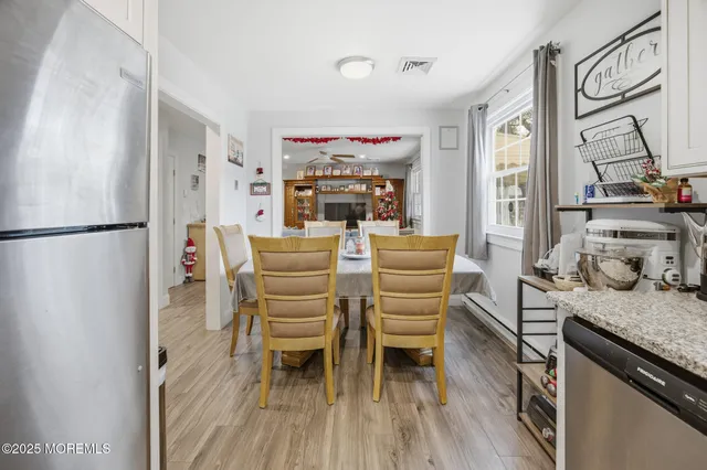 a kitchen with granite countertop a sink stove and refrigerator