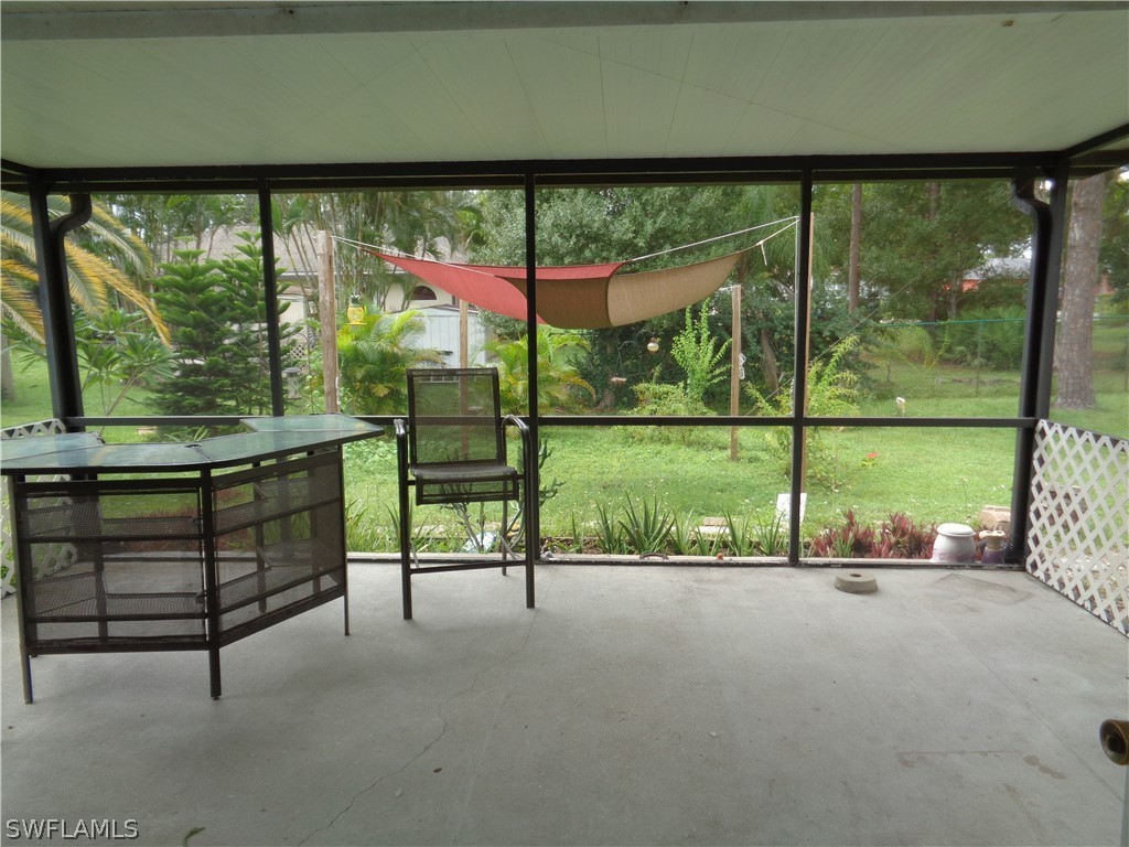 18538 Violet Road Fort Myers, FL 33967 - Photo 11 of 13 a view of a sitting area with a floor to ceiling window