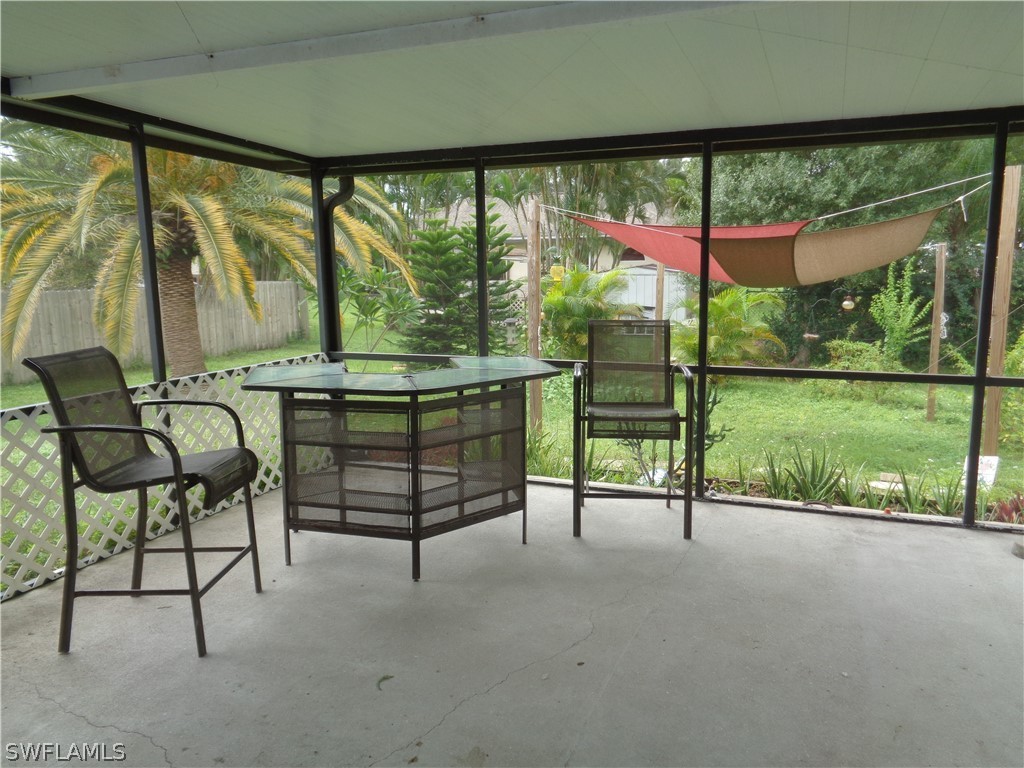 18538 Violet Road Fort Myers, FL 33967 - Photo 13 of 13 a view of a two chair in the room next to a yard
