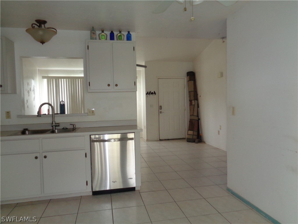 18538 Violet Road Fort Myers, FL 33967 - Photo 3 of 13 a kitchen with a sink cabinets and utility