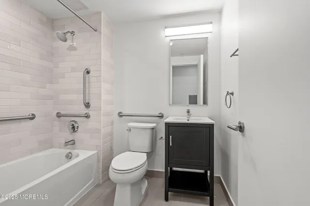 a bathroom with a sink a toilet and a bathtub