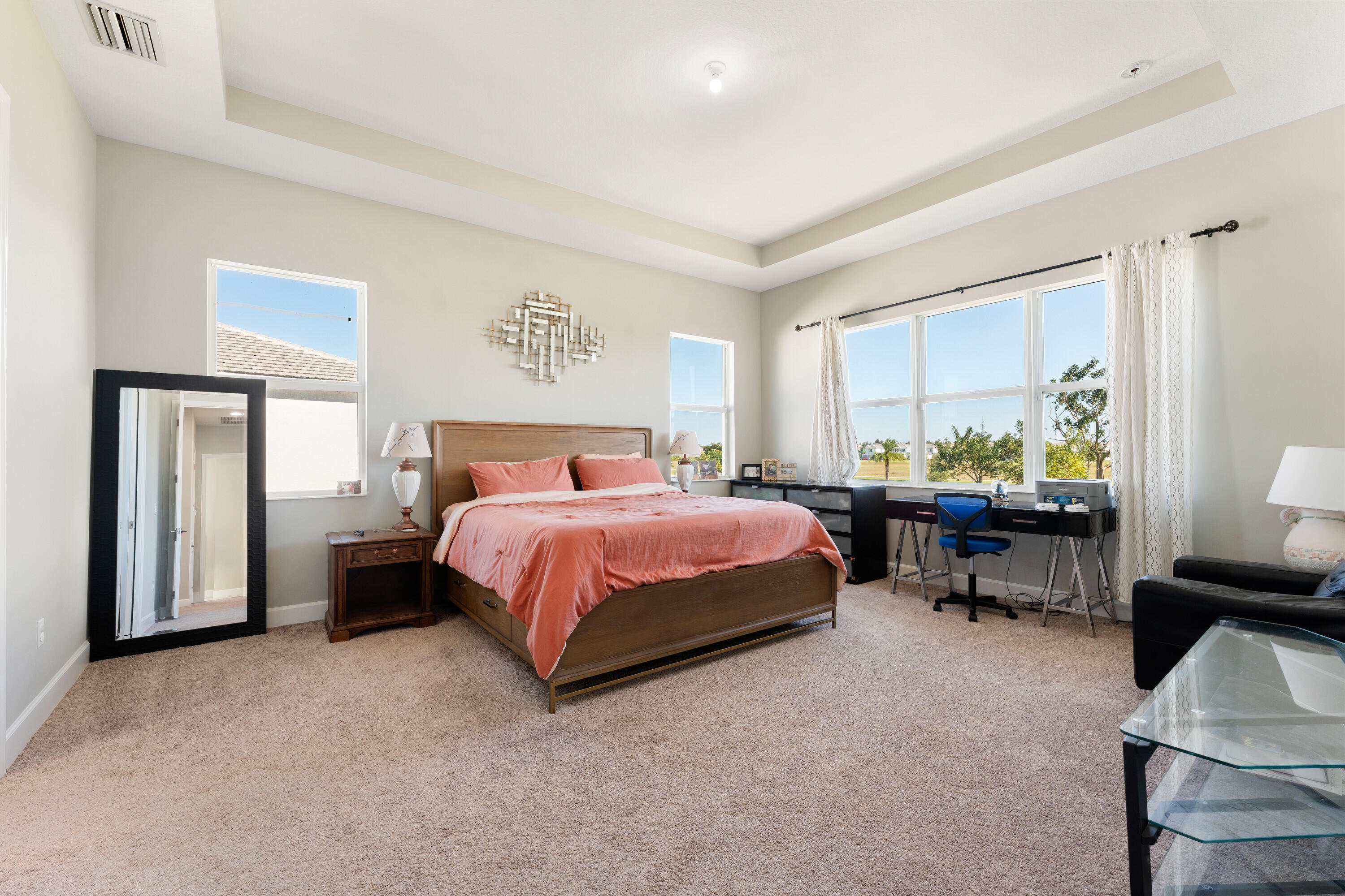 5446 Macoon Way Westlake, FL 33470 - Photo 13 of 40 a spacious bedroom with a bed and a couch