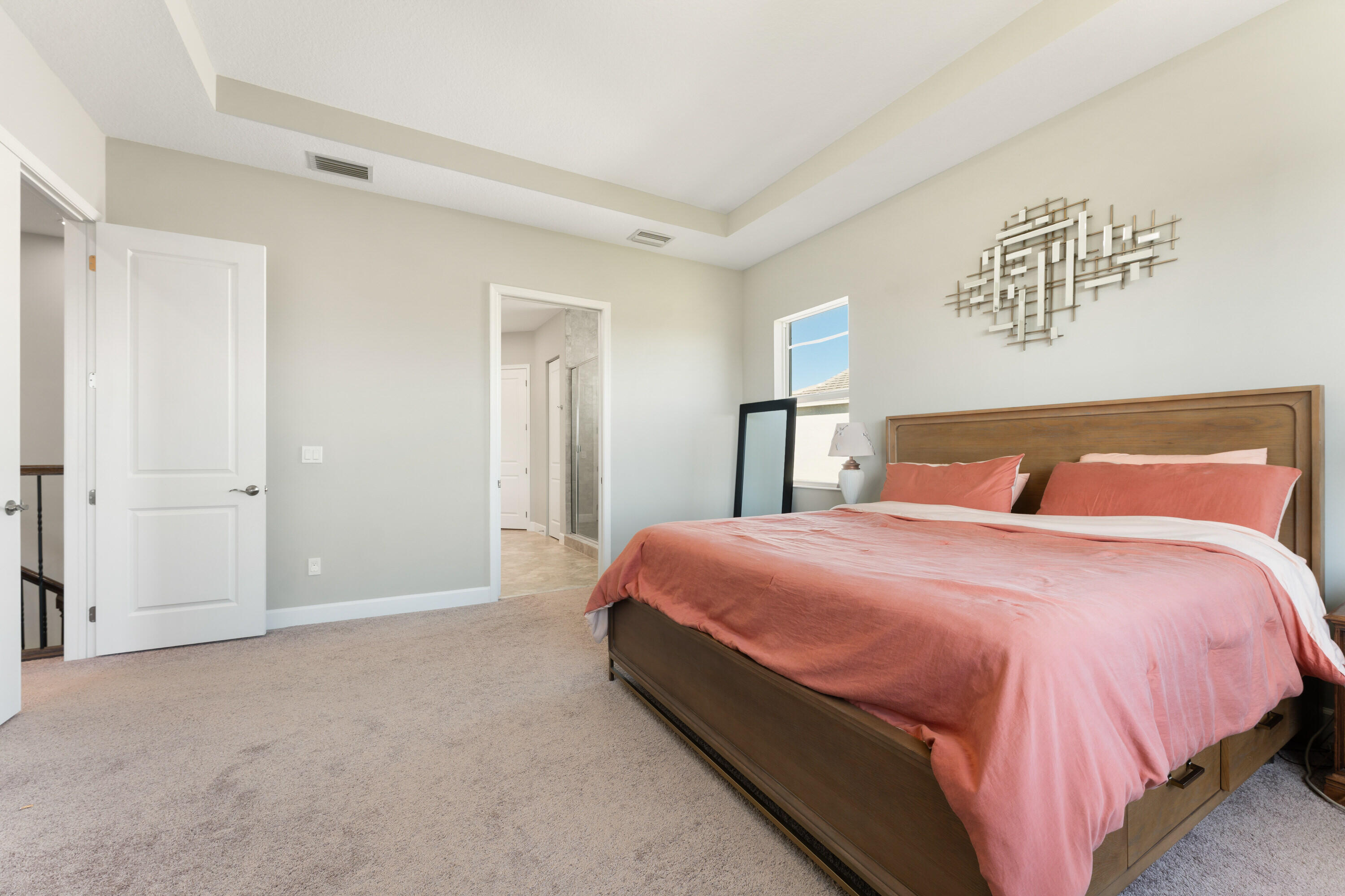 5446 Macoon Way Westlake, FL 33470 - Photo 15 of 40 a bedroom with a bed and a night stand