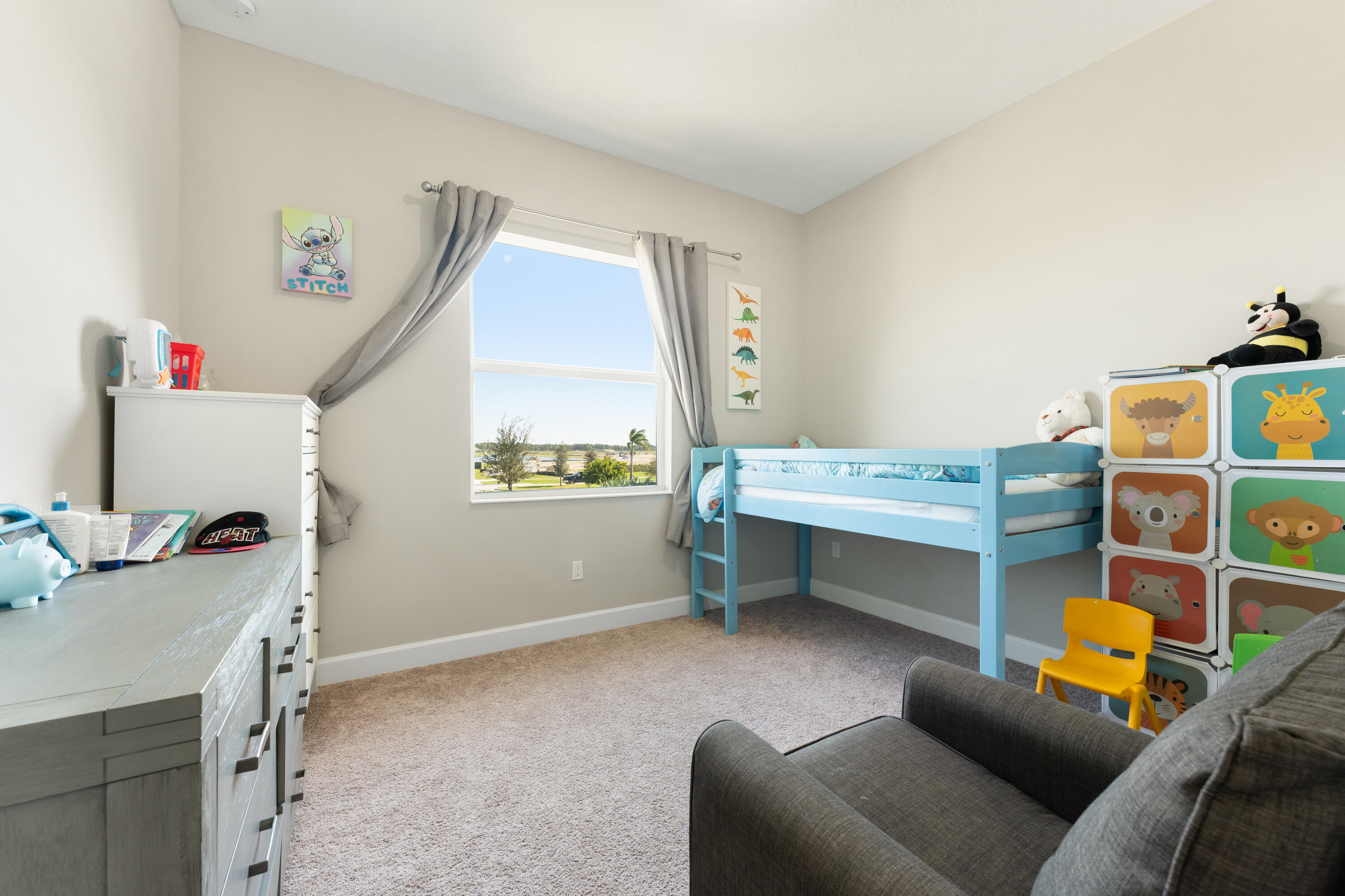 5446 Macoon Way Westlake, FL 33470 - Photo 17 of 40 a bedroom with furniture and a window