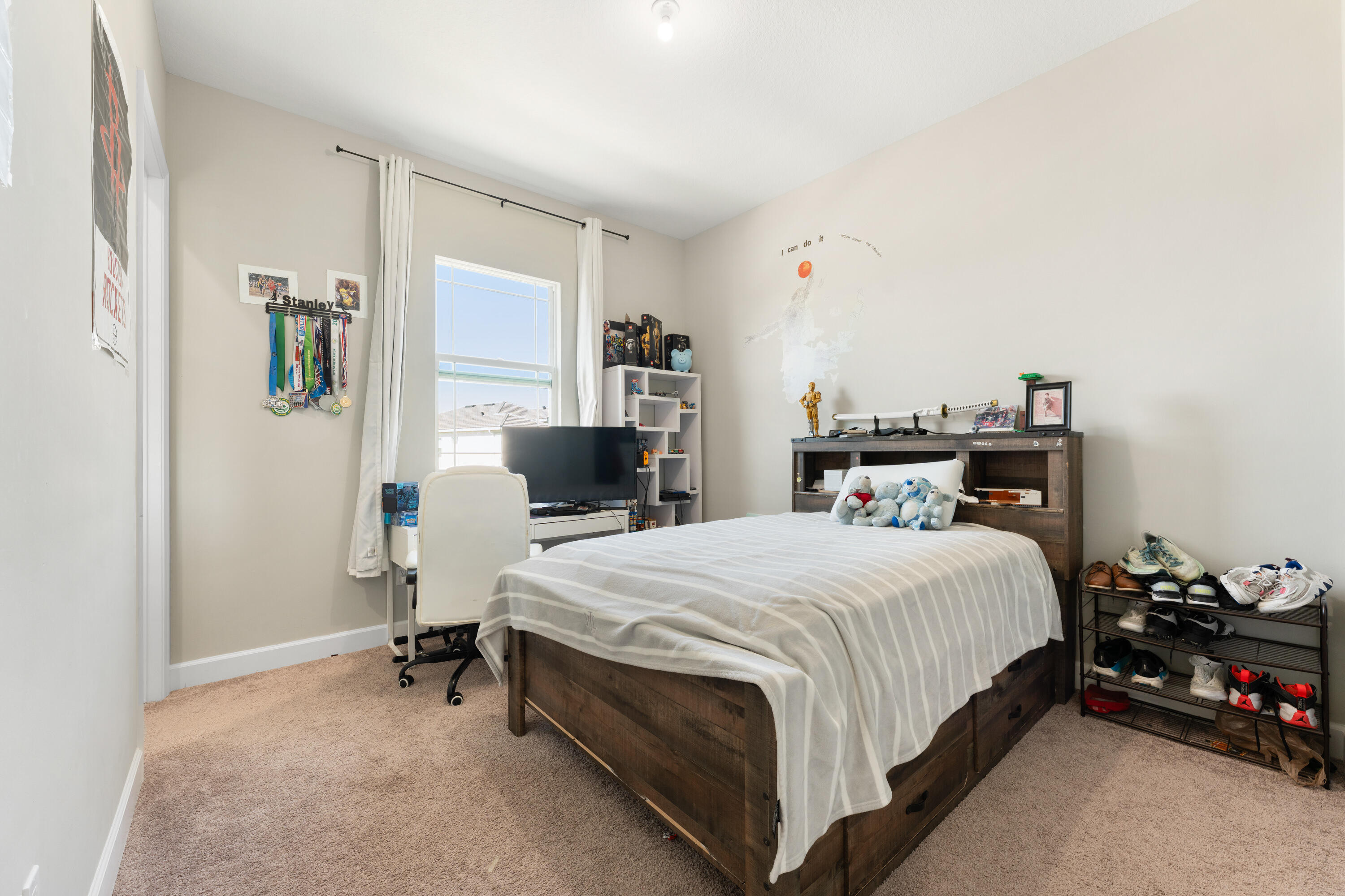 5446 Macoon Way Westlake, FL 33470 - Photo 19 of 40 a bedroom with a bed and wooden floor