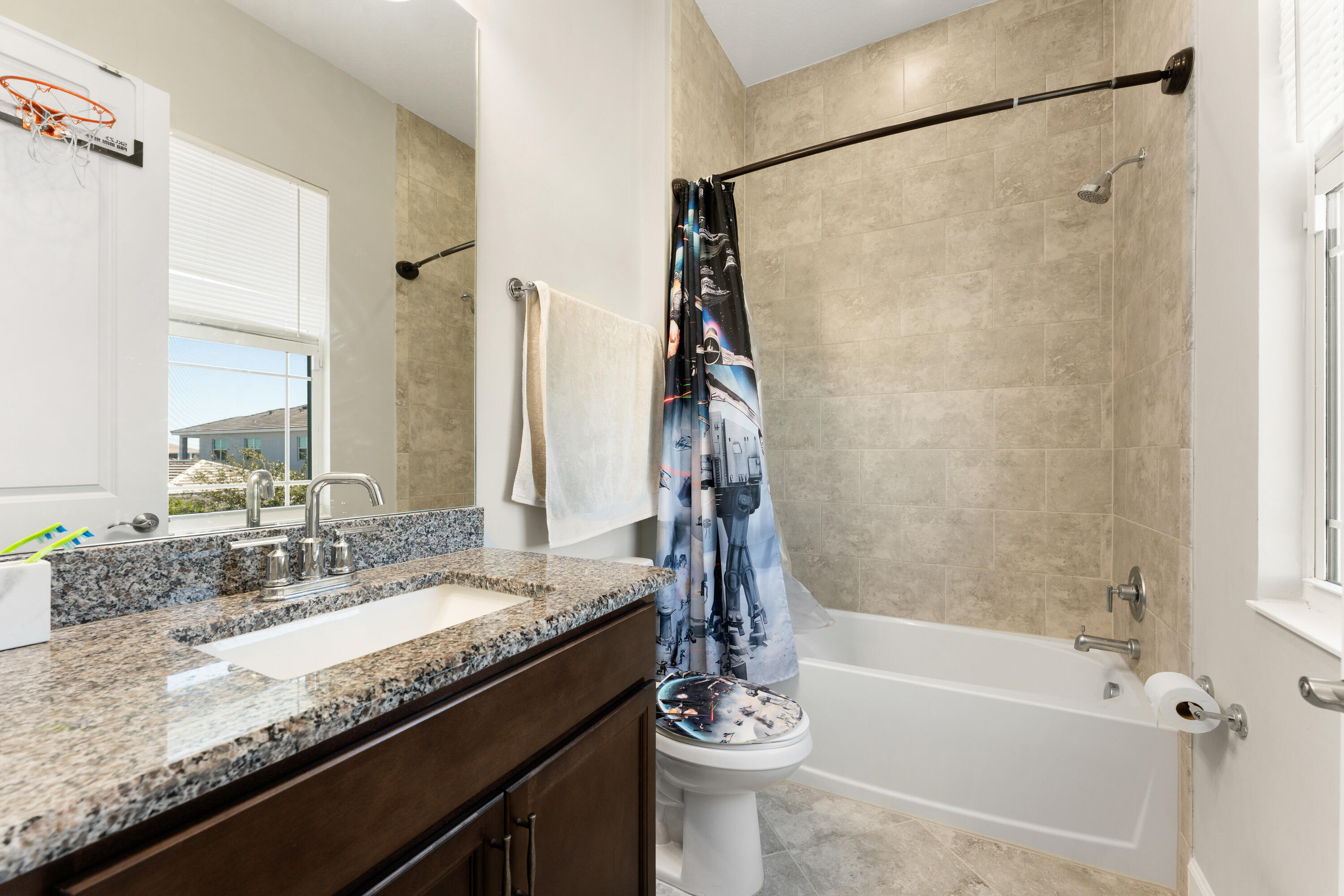 5446 Macoon Way Westlake, FL 33470 - Photo 20 of 40 a bathroom with a granite countertop sink toilet and shower