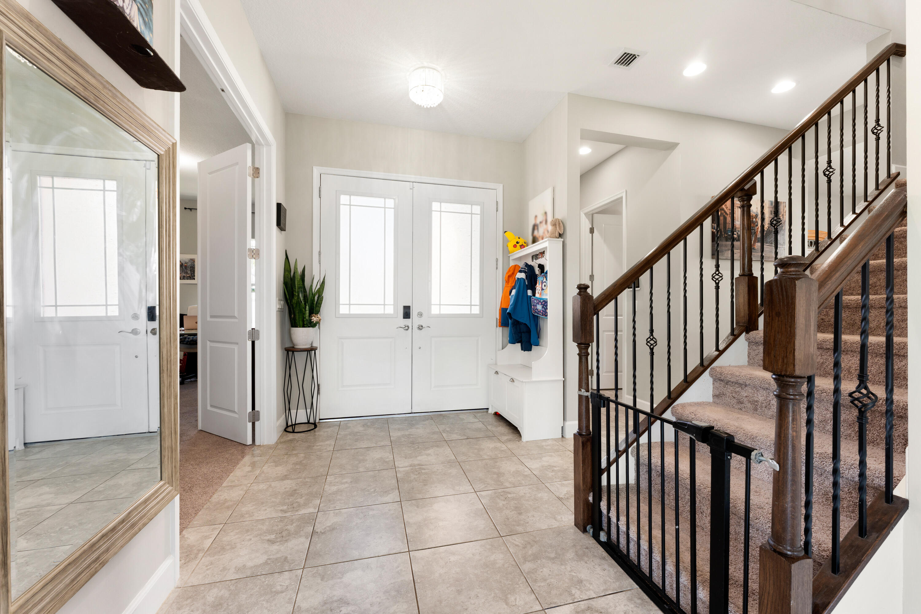 5446 Macoon Way Westlake, FL 33470 - Photo 2 of 40 a view of an entryway with staircase