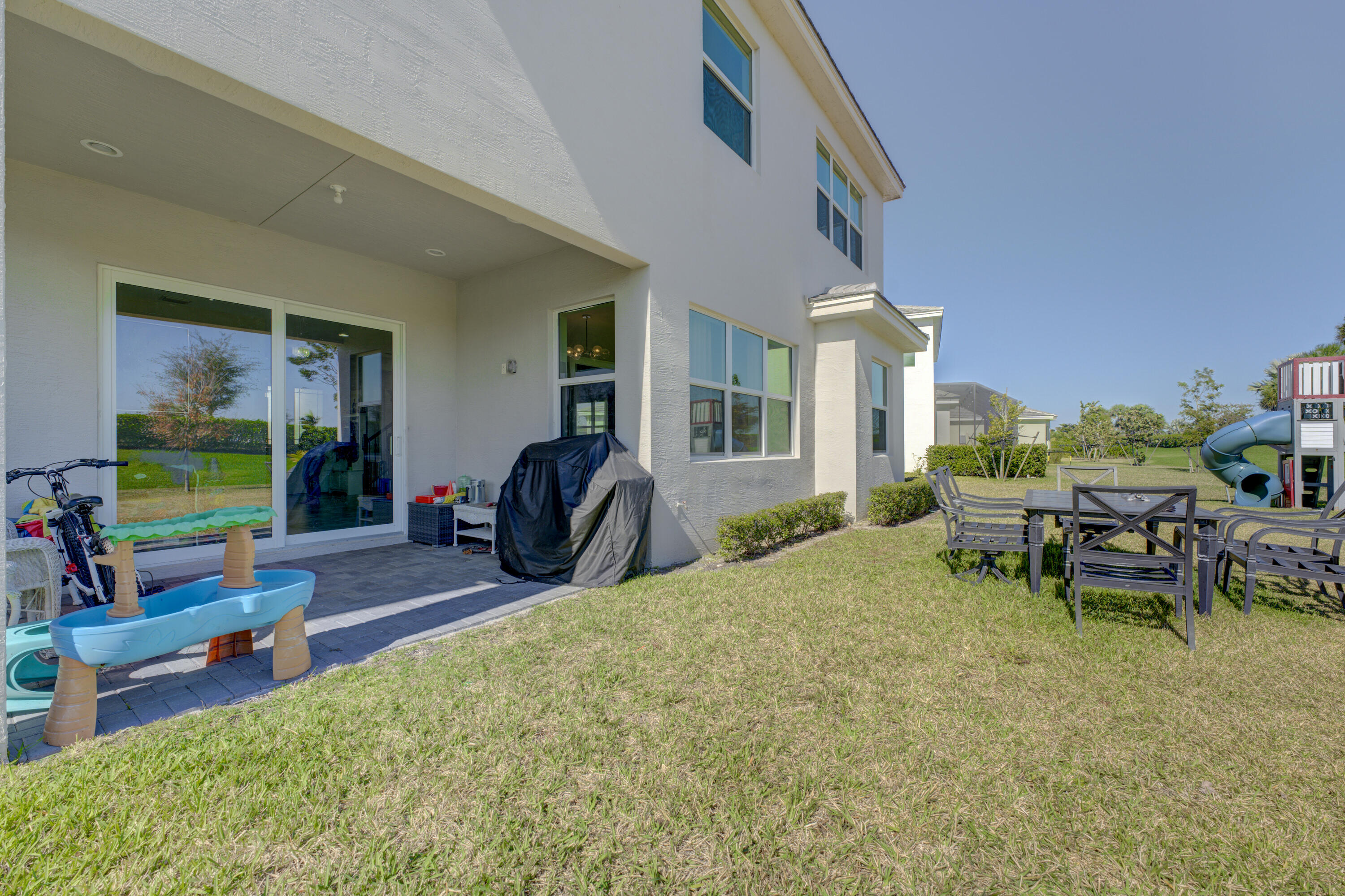 5446 Macoon Way Westlake, FL 33470 - Photo 25 of 40 a view of two chairs in a patio