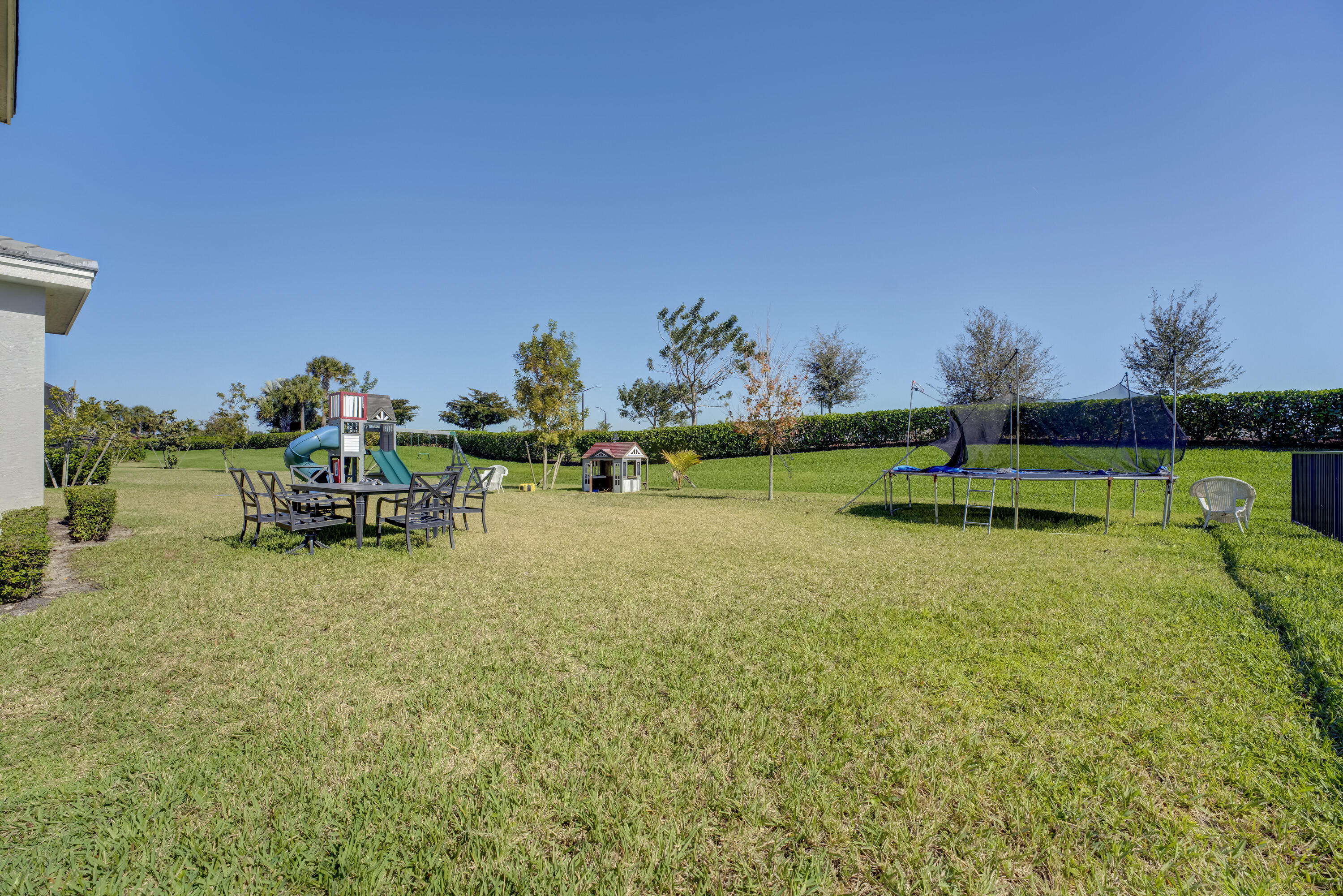 5446 Macoon Way Westlake, FL 33470 - Photo 26 of 40 a childrens park with lots of swings and slides