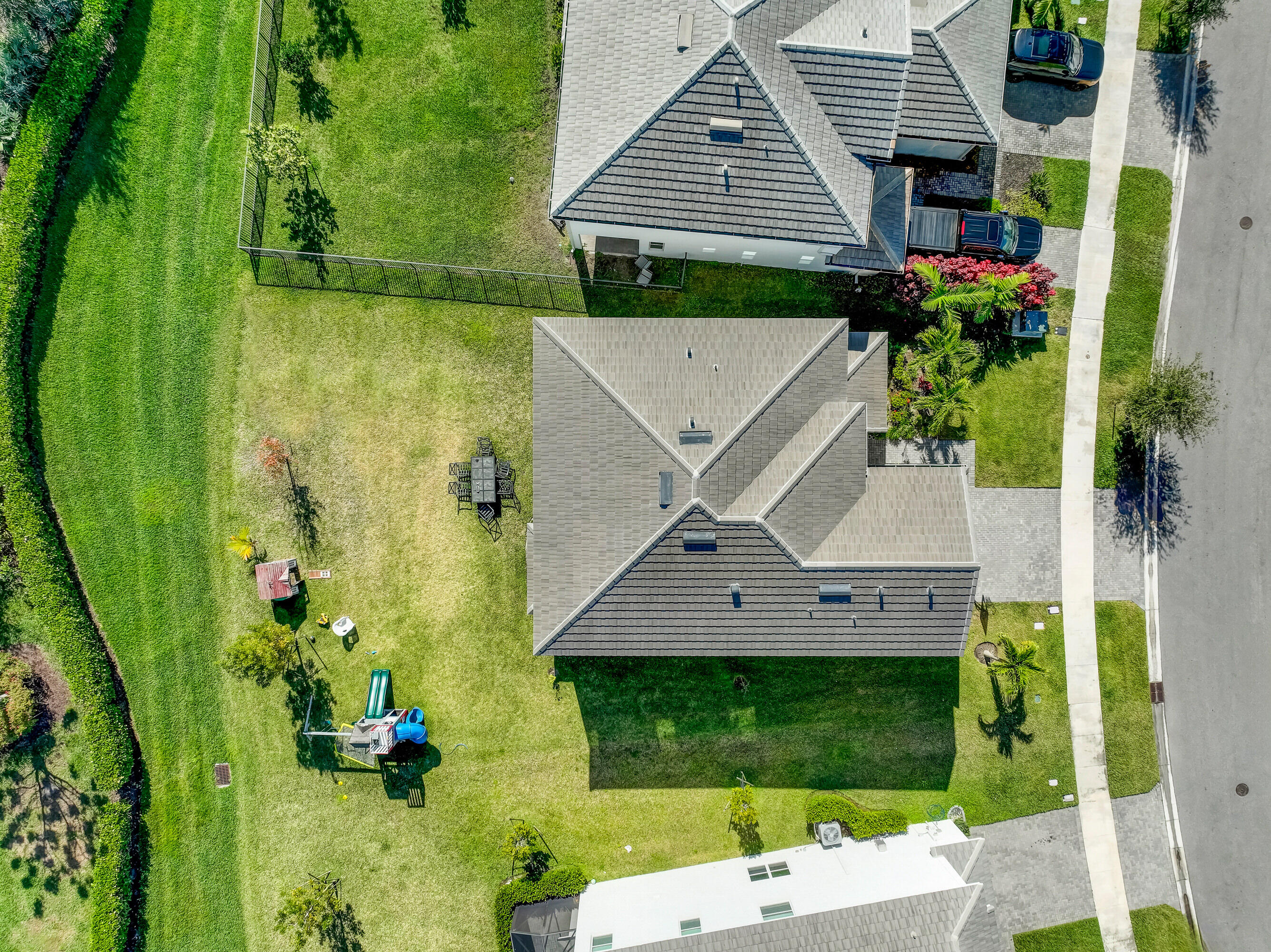 5446 Macoon Way Westlake, FL 33470 - Photo 36 of 40 an aerial view of a house with a yard