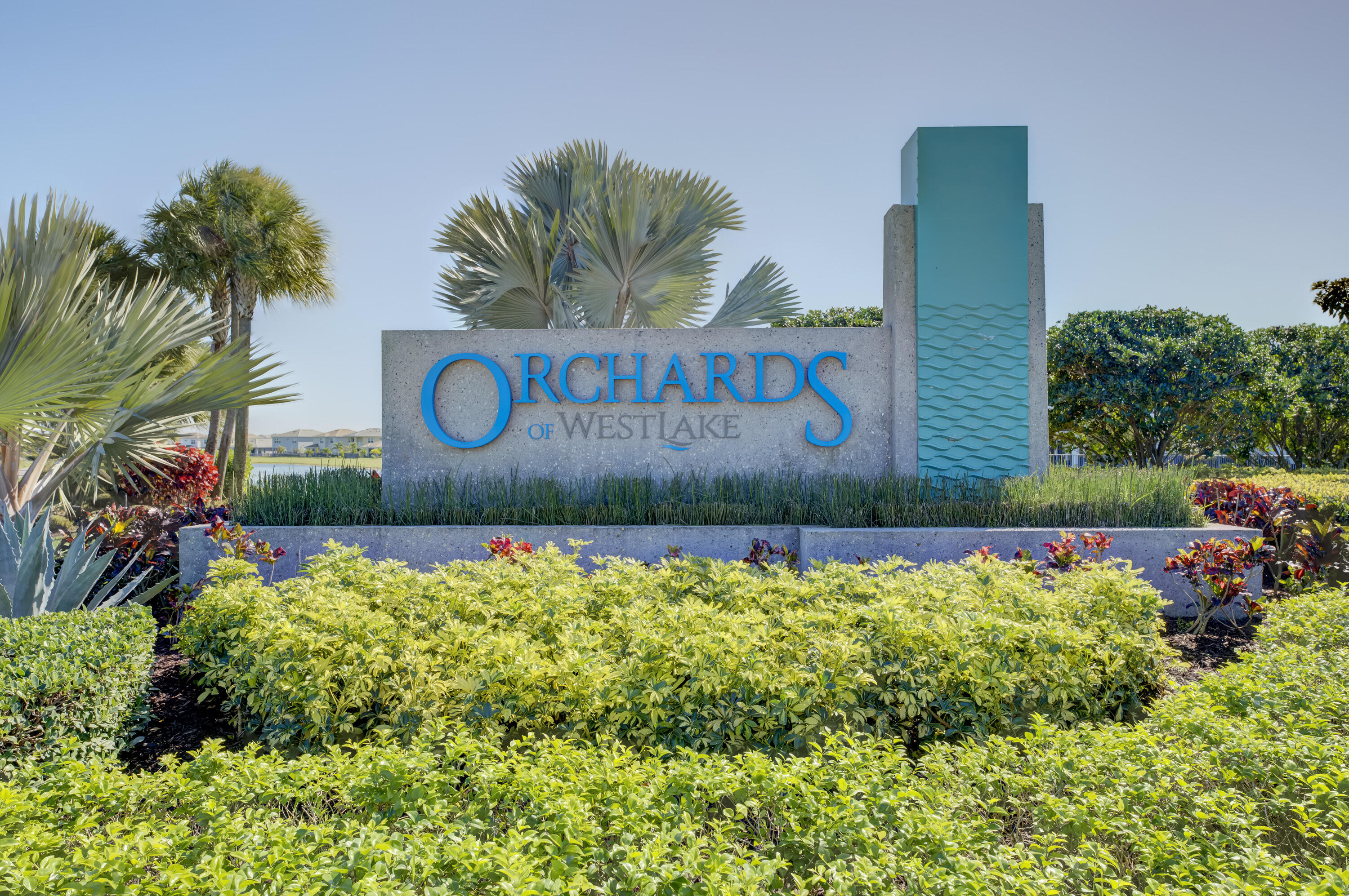 5446 Macoon Way Westlake, FL 33470 - Photo 37 of 40 a view of sign board with flower around