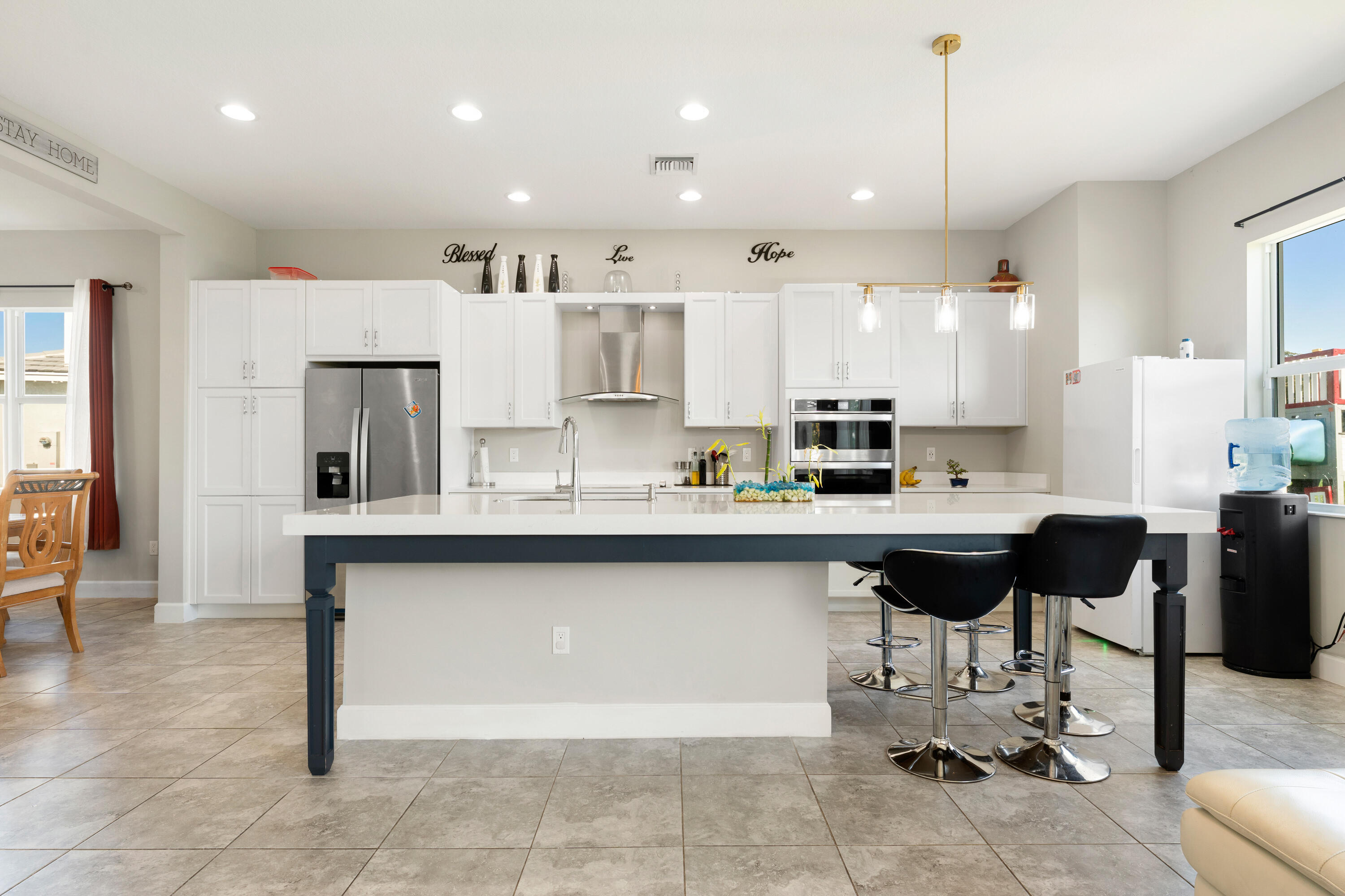 5446 Macoon Way Westlake, FL 33470 - Photo 6 of 40 a kitchen with a sink cabinets and window