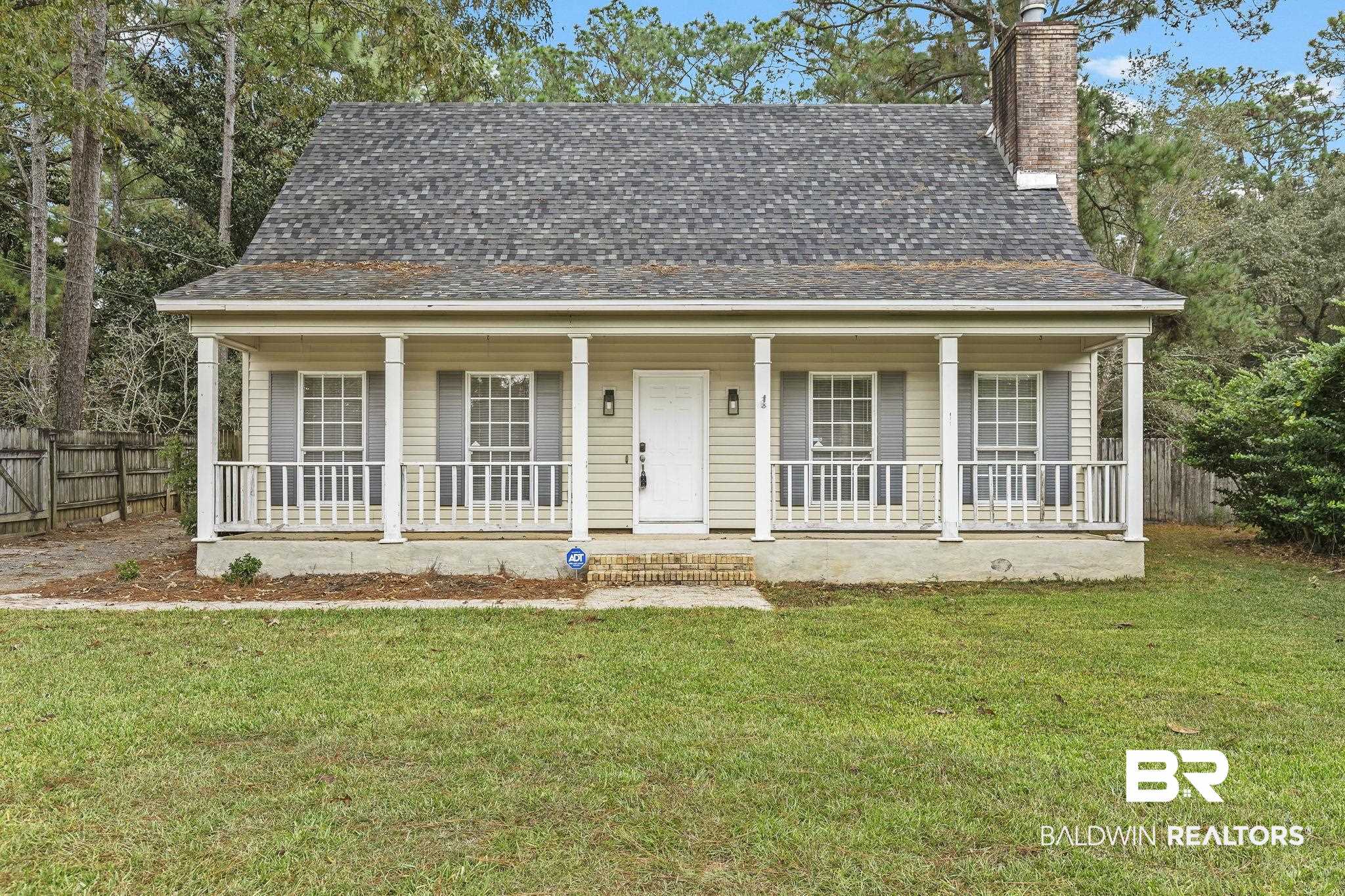 474 Ridgewood Drive Daphne, AL 36526 - Photo 2 of 57 View of front facade featuring covered porch and a front lawn