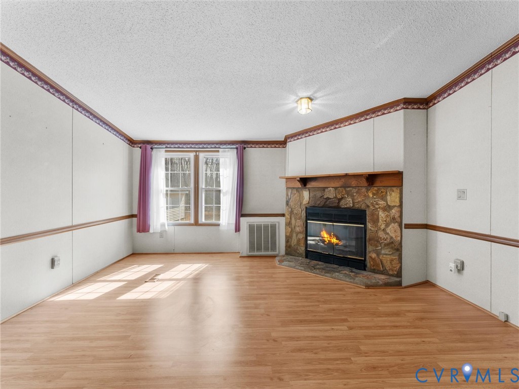 1349 Whispering Road Dillwyn, VA 23936 - Photo 12 of 51 a view of a livingroom with a fireplace a window and a fireplace