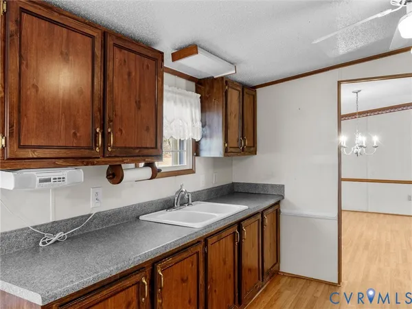 a kitchen with stainless steel appliances a sink a stove and a refrigerator