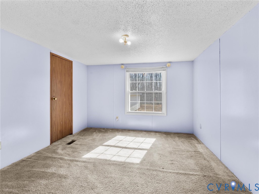 1349 Whispering Road Dillwyn, VA 23936 - Photo 34 of 51 an empty room with windows