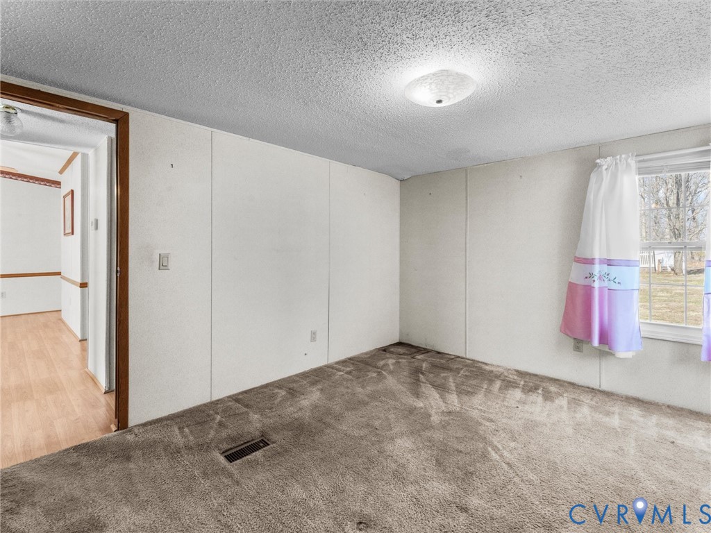 1349 Whispering Road Dillwyn, VA 23936 - Photo 38 of 51 an empty room with windows and closet