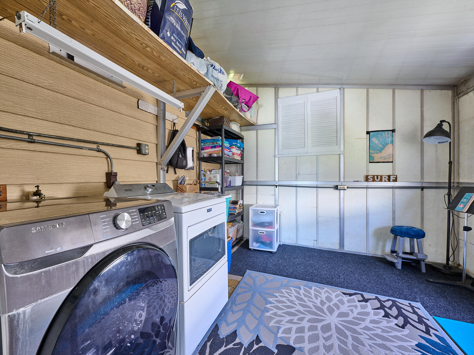 6977 Southeast Delegate Street Hobe Sound, FL 33455 - Photo 45 of 60 a kitchen with a refrigerator and a sink