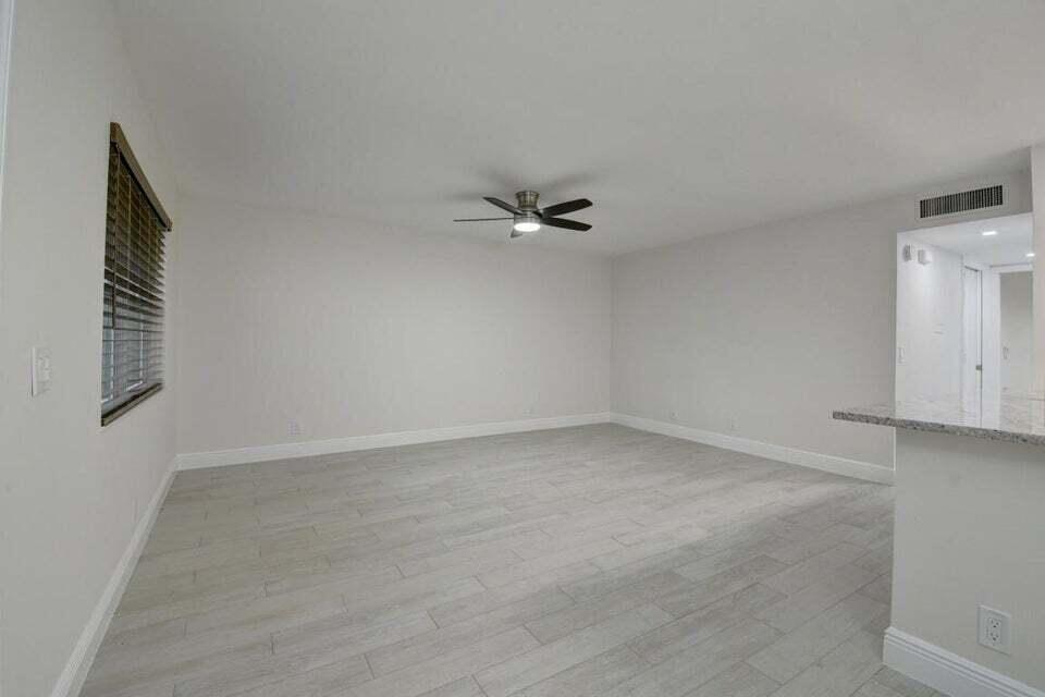 93 Normandy B Delray Beach, FL 33484 - Photo 5 of 44 a view of an empty room