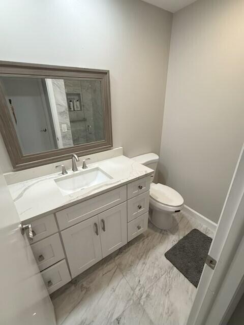 93 Normandy B Delray Beach, FL 33484 - Photo 9 of 44 a bathroom with a sink toilet and mirror