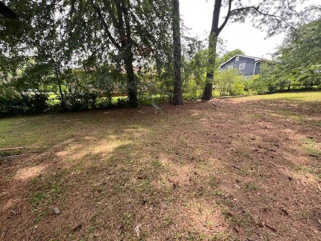 6935 Fielder Road Rex, GA 30273 - Photo 22 of 22 a view of a yard with large trees