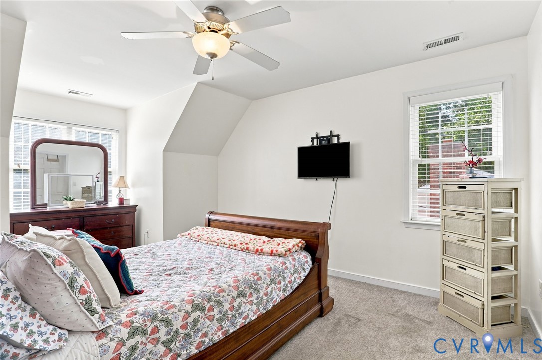 6401 Poplar Road Quinton, VA 23141 - Photo 20 of 46 Bedroom with angled ceiling, recessed window, and