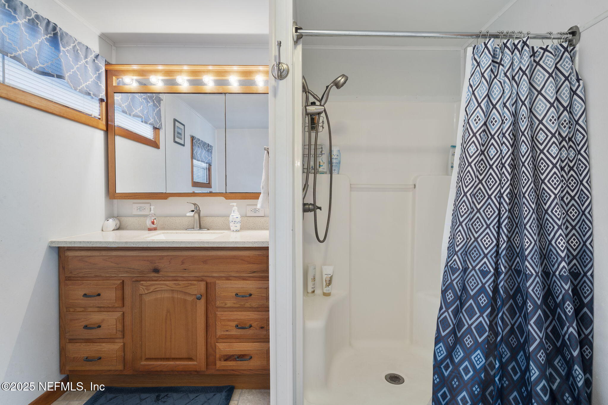 114 Sawyer Street Interlachen, FL 32148 - Photo 22 of 28 a bathroom with a sink and a mirror