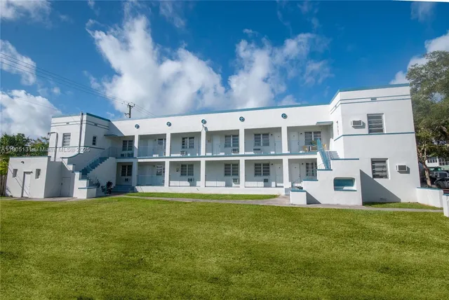 a large building with a big yard