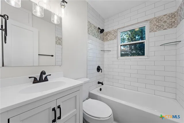 a view of a house with a small yard