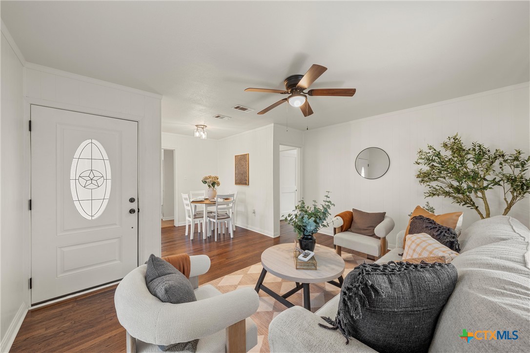 1203 South 5th Street Temple, TX 76504 - Photo 5 of 20 a living room with furniture and a large window