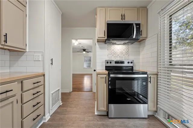 a bathroom with a double vanity sink and mirror