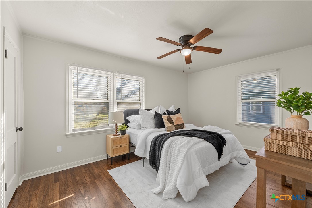1203 South 5th Street Temple, TX 76504 - Photo 9 of 18 a bedroom with a bed and a window