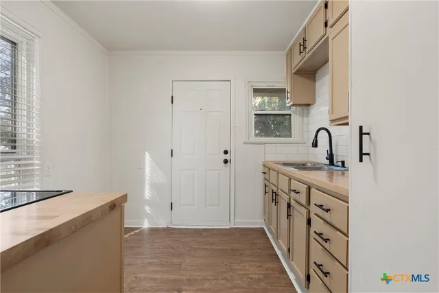 a kitchen with a stove and a sink