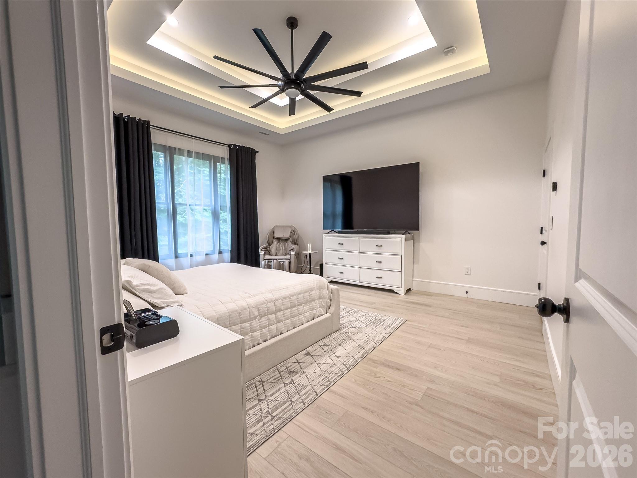 668 Players Ridge Road Hickory, NC 28601 - Photo 17 of 48 a bedroom with a bed and a flat screen tv