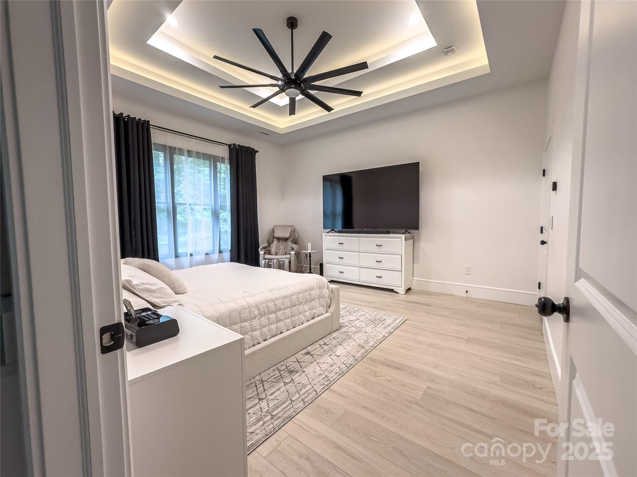 668 Players Ridge Road Hickory, NC 28601 - Photo 17 of 48 a bedroom with a bed and a flat screen tv