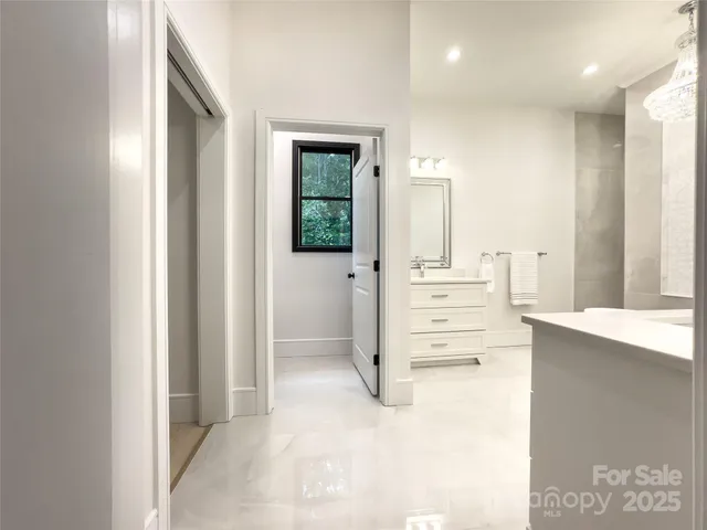 a bathroom with a double vanity sink mirror and double