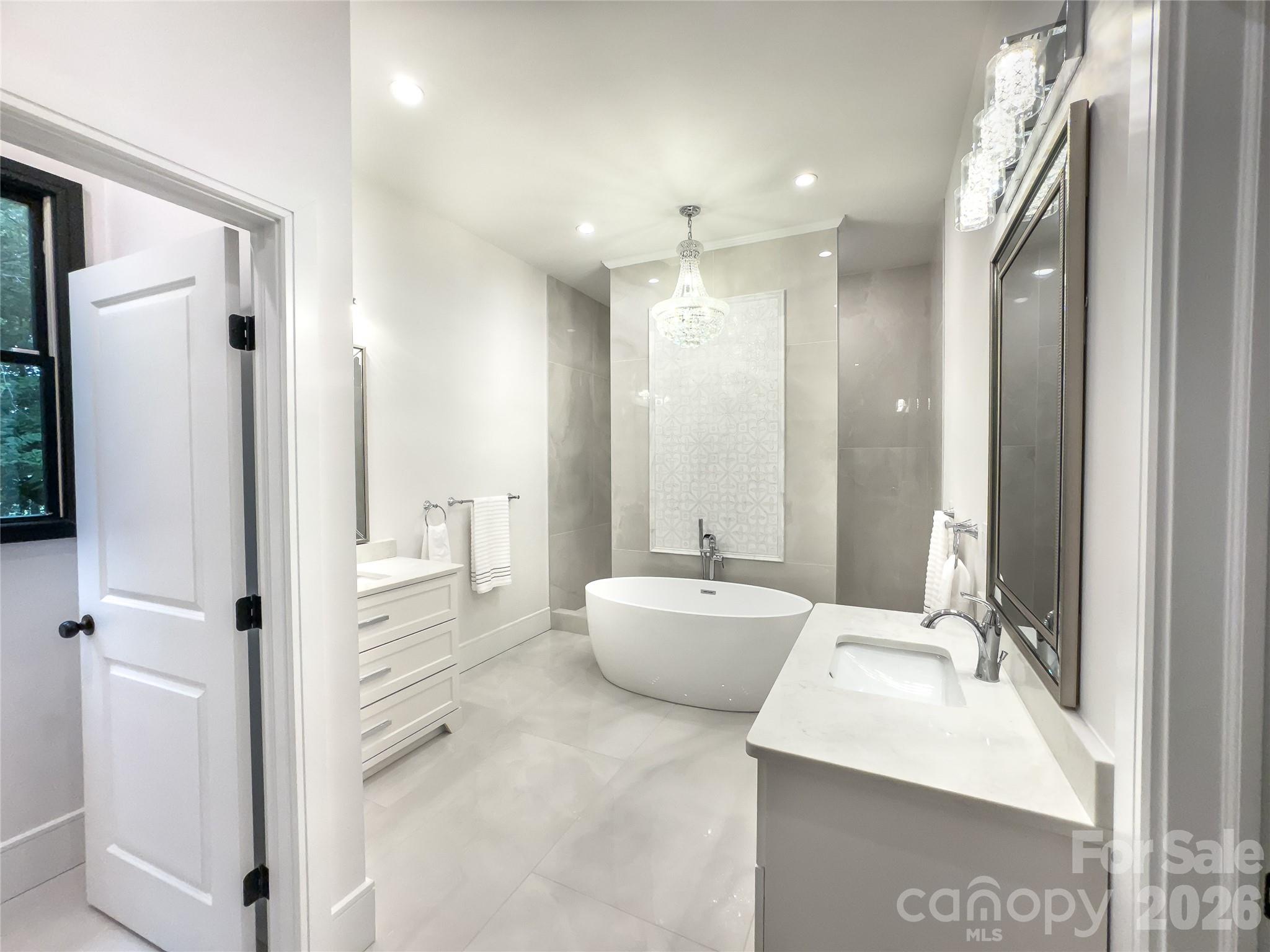 668 Players Ridge Road Hickory, NC 28601 - Photo 20 of 48 a bathroom with a double vanity sink mirror and double