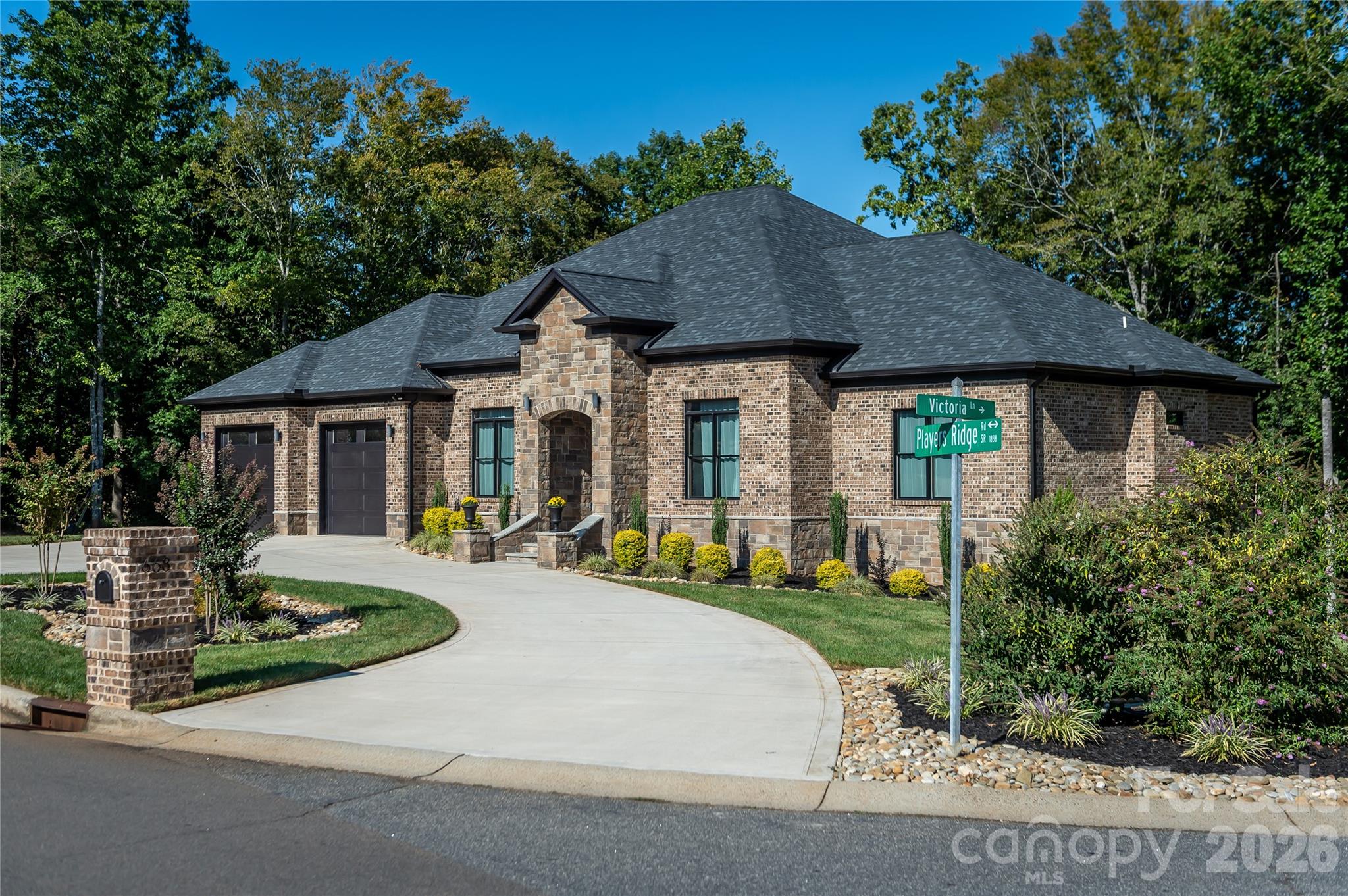 668 Players Ridge Road Hickory, NC 28601 - Photo 2 of 48 a front view of a house with a yard