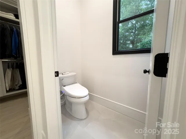 a spacious bathroom with a sink a mirror and shower