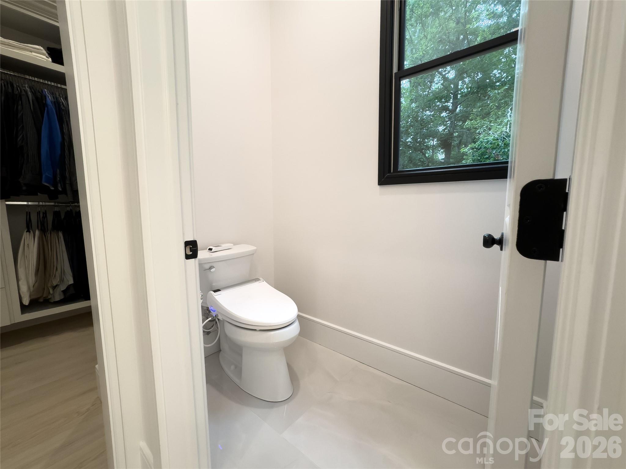 668 Players Ridge Road Hickory, NC 28601 - Photo 21 of 48 a white toilet sitting next to a window