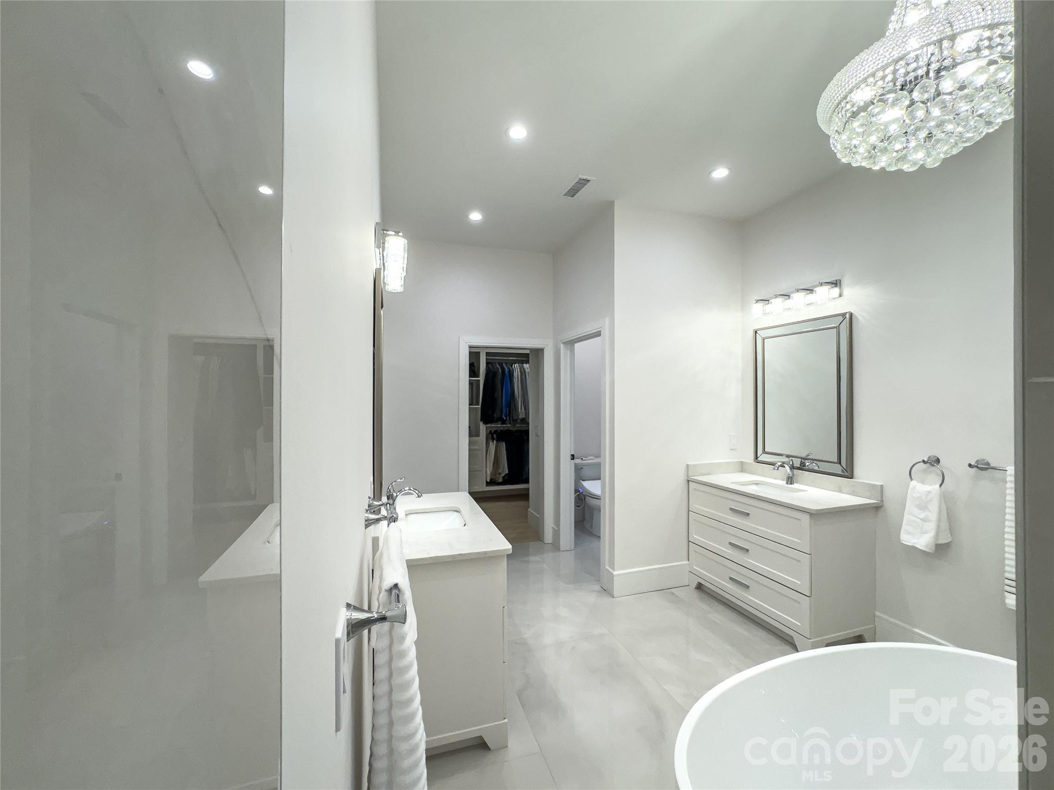 668 Players Ridge Road Hickory, NC 28601 - Photo 22 of 48 a spacious bathroom with a sink a mirror and shower