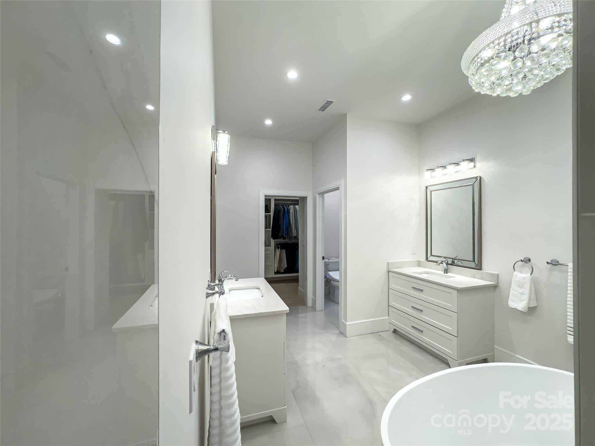 668 Players Ridge Road Hickory, NC 28601 - Photo 22 of 48 a spacious bathroom with a sink a mirror and shower