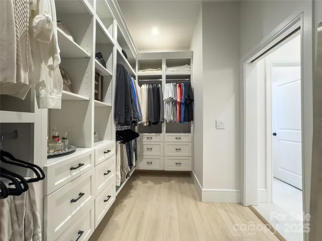 a bathroom with a sink a mirror and a shower