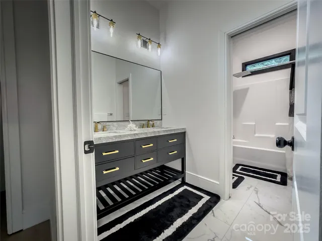 a bathroom with a toilet and a bathtub