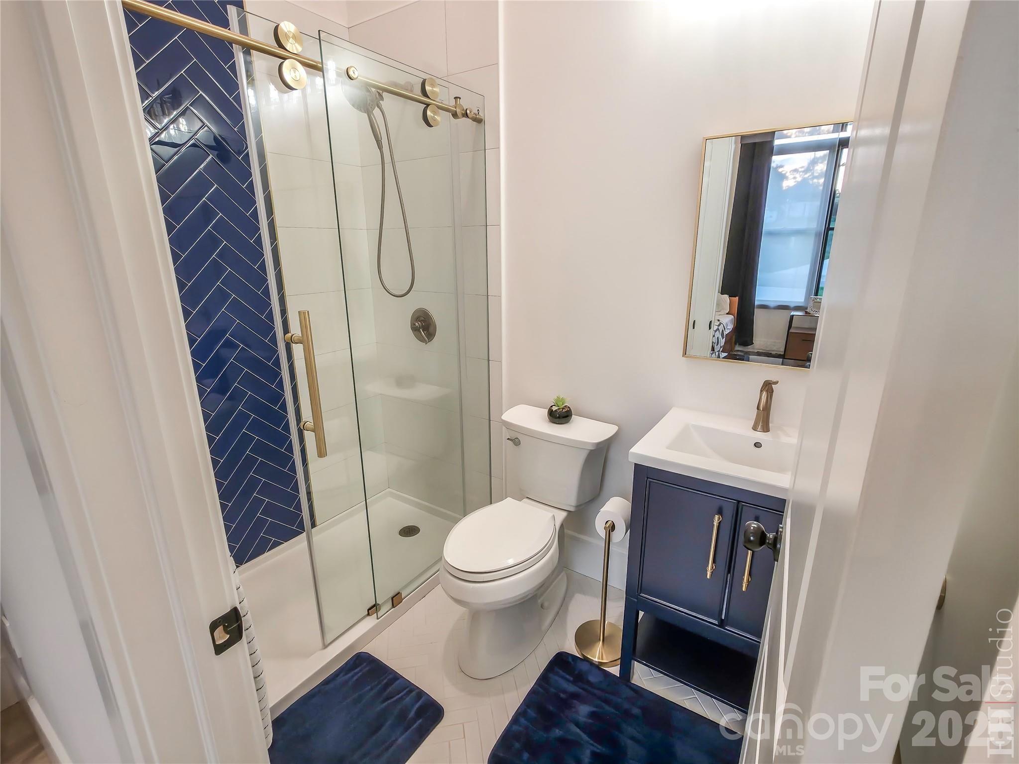 668 Players Ridge Road Hickory, NC 28601 - Photo 27 of 48 a bathroom with a toilet and a shower