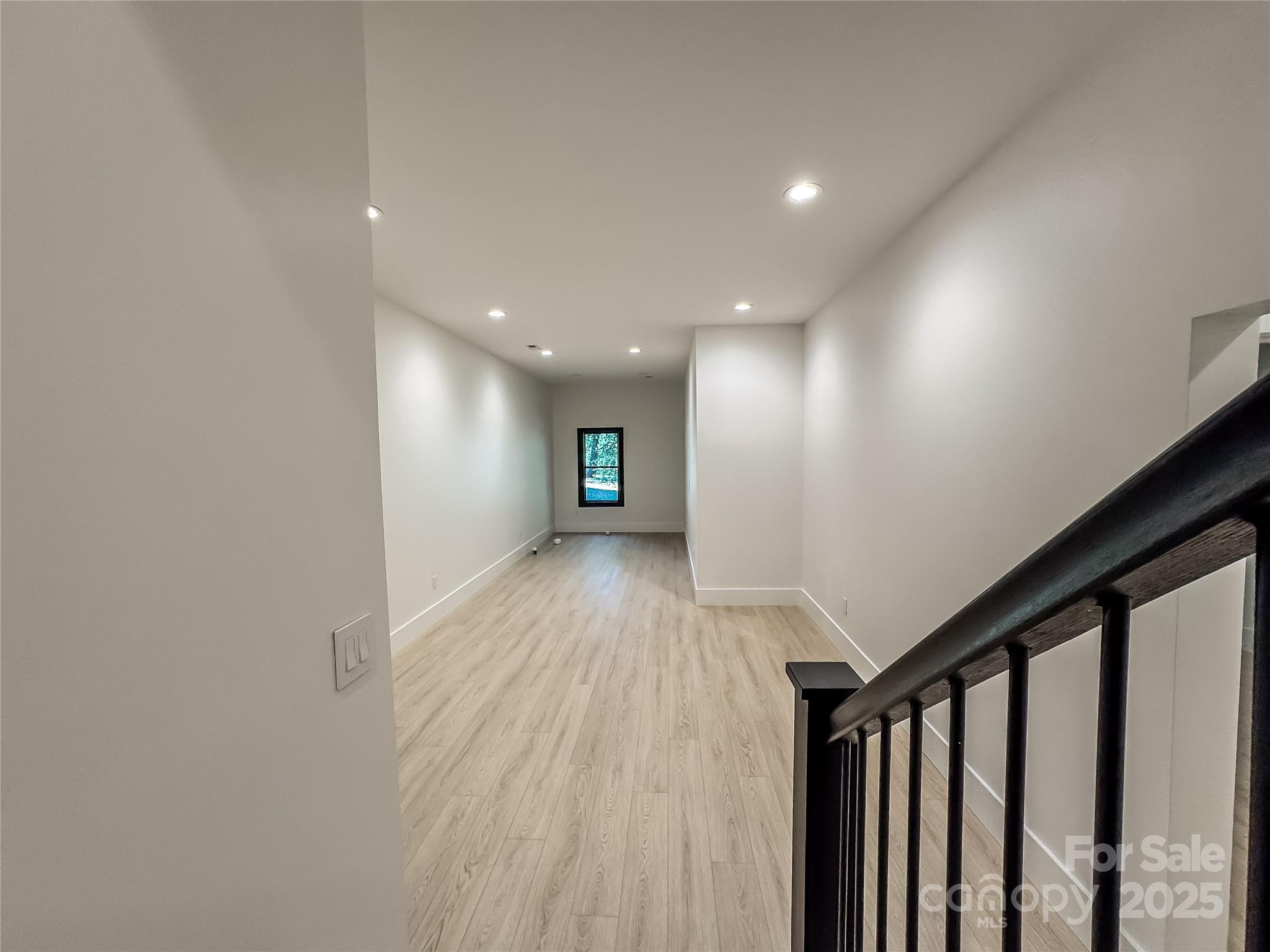 668 Players Ridge Road Hickory, NC 28601 - Photo 34 of 48 a view of a hallway with wooden floor
