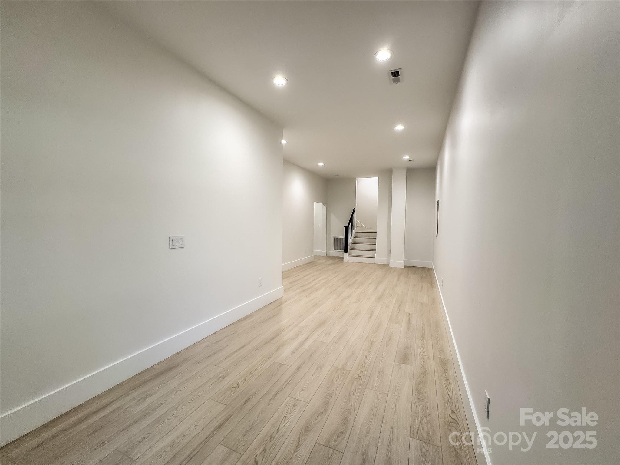 668 Players Ridge Road Hickory, NC 28601 - Photo 35 of 48 a view of hallway with wooden floor