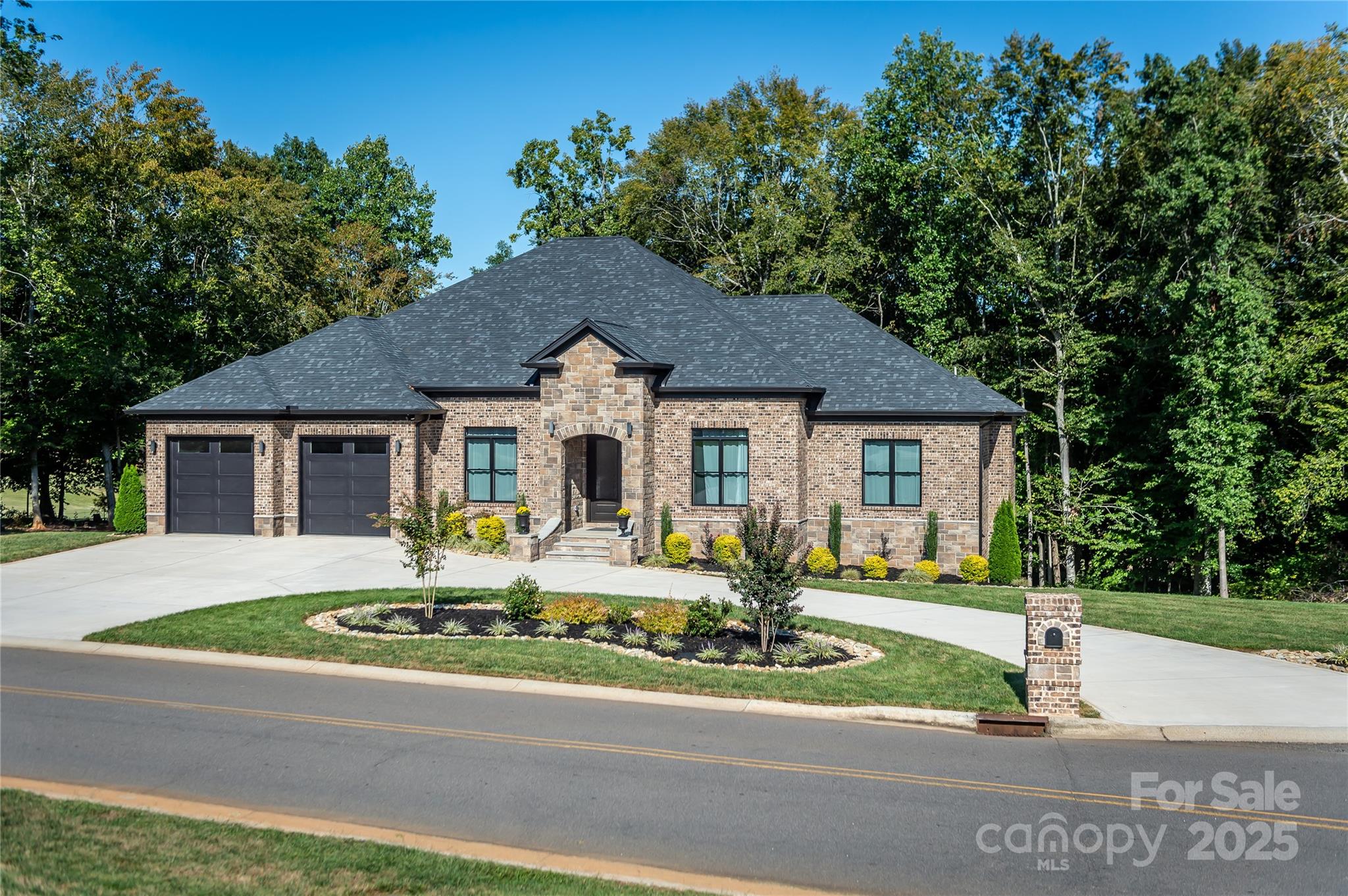 668 Players Ridge Road Hickory, NC 28601 - Photo 44 of 48 a front view of a house with a yard table and chairs