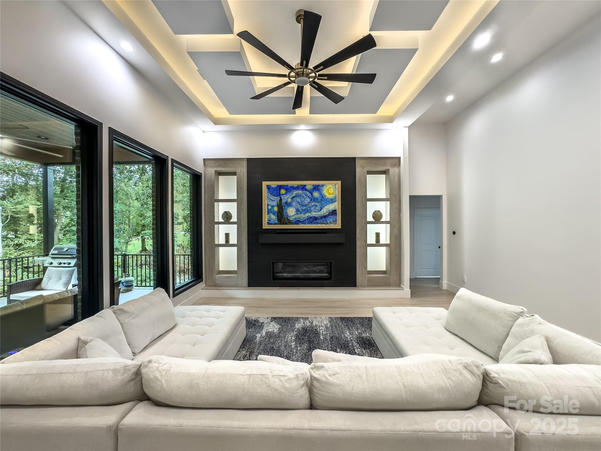 668 Players Ridge Road Hickory, NC 28601 - Photo 6 of 48 a living room with furniture ceiling fan and a large window