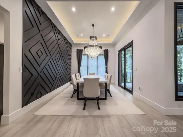 a view of a dining room with furniture and window